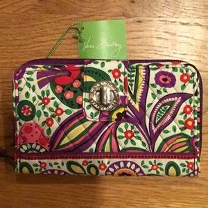 NWT Vera Bradley Turn Lock wallet. Excellent condition, no flaws .Viva La Vera